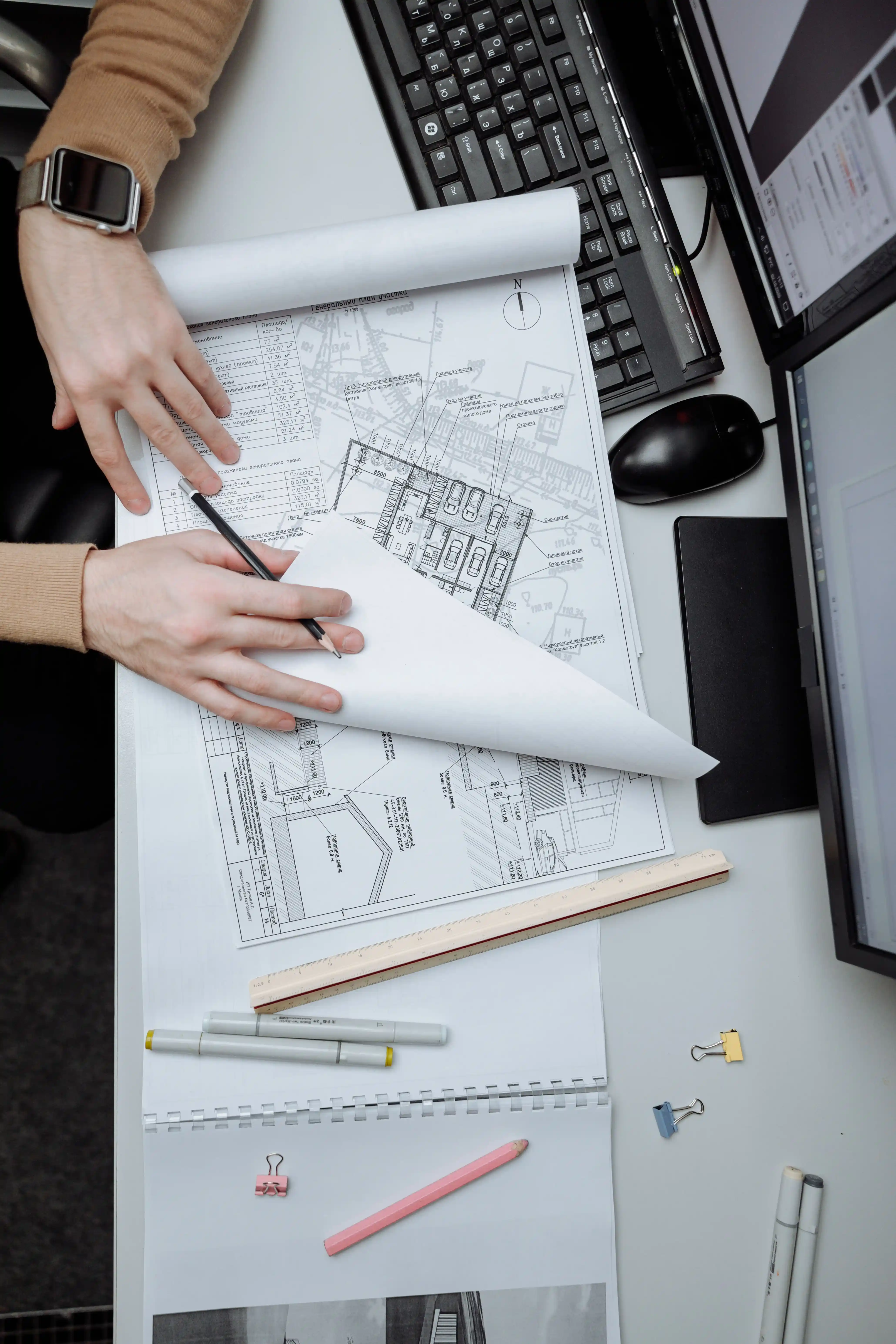 Engineering experts cross-examining municipal blueprints and survey logs on site execution ground